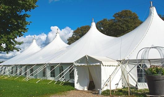 a group of luxury portable restrooms with individual stalls and running water in Haddock